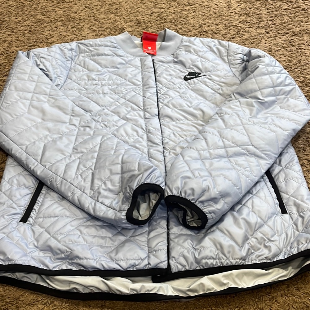 Women’s lightweight light blue and black puffer jacket size medium